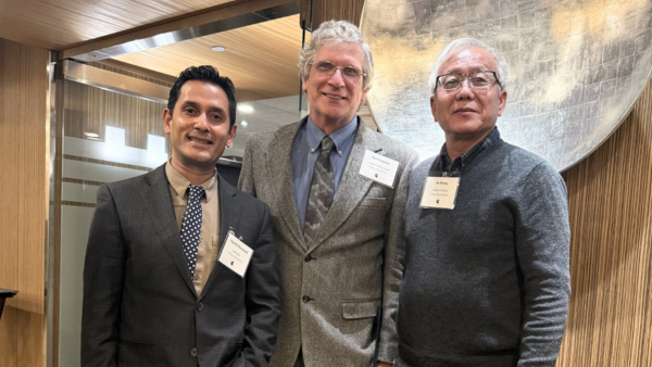Dean Rayamajhi and two retiring faculty at a reception